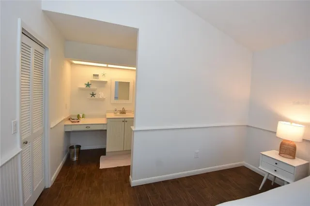 a bathroom with a sink vanity and a mirror