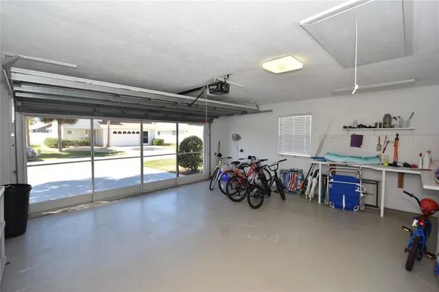 a living room with a large window table and chairs