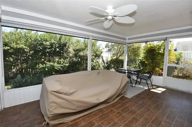 a view of a house with backyard porch and sitting area