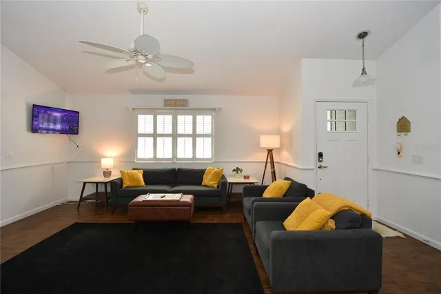 a living room with furniture and a window