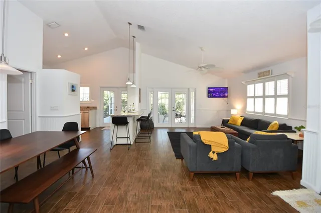 a living room with furniture window and wooden floor