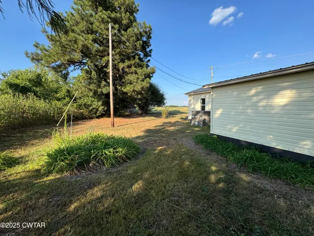 a view of outdoor space and yard
