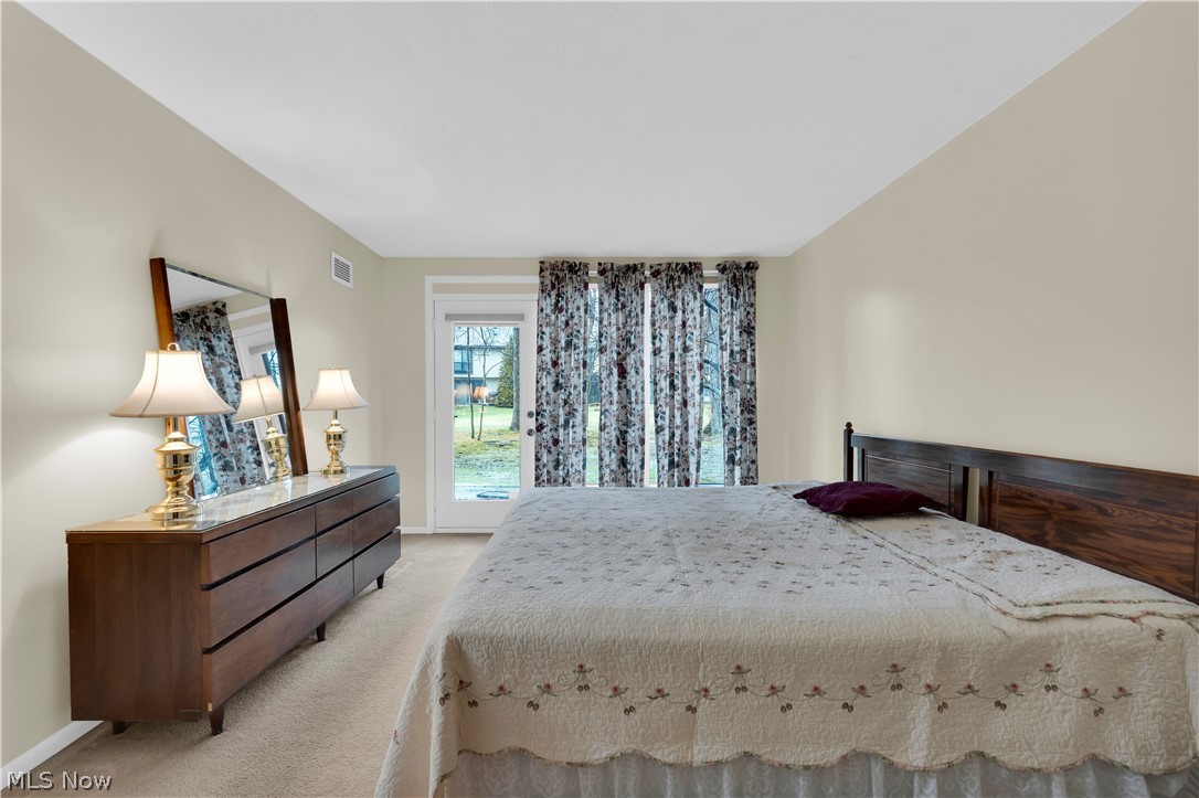 985 Canyon View Road, Unit 108D Northfield, OH 44067 - Photo 13 of 18 Bedroom with carpet flooring and baseboards