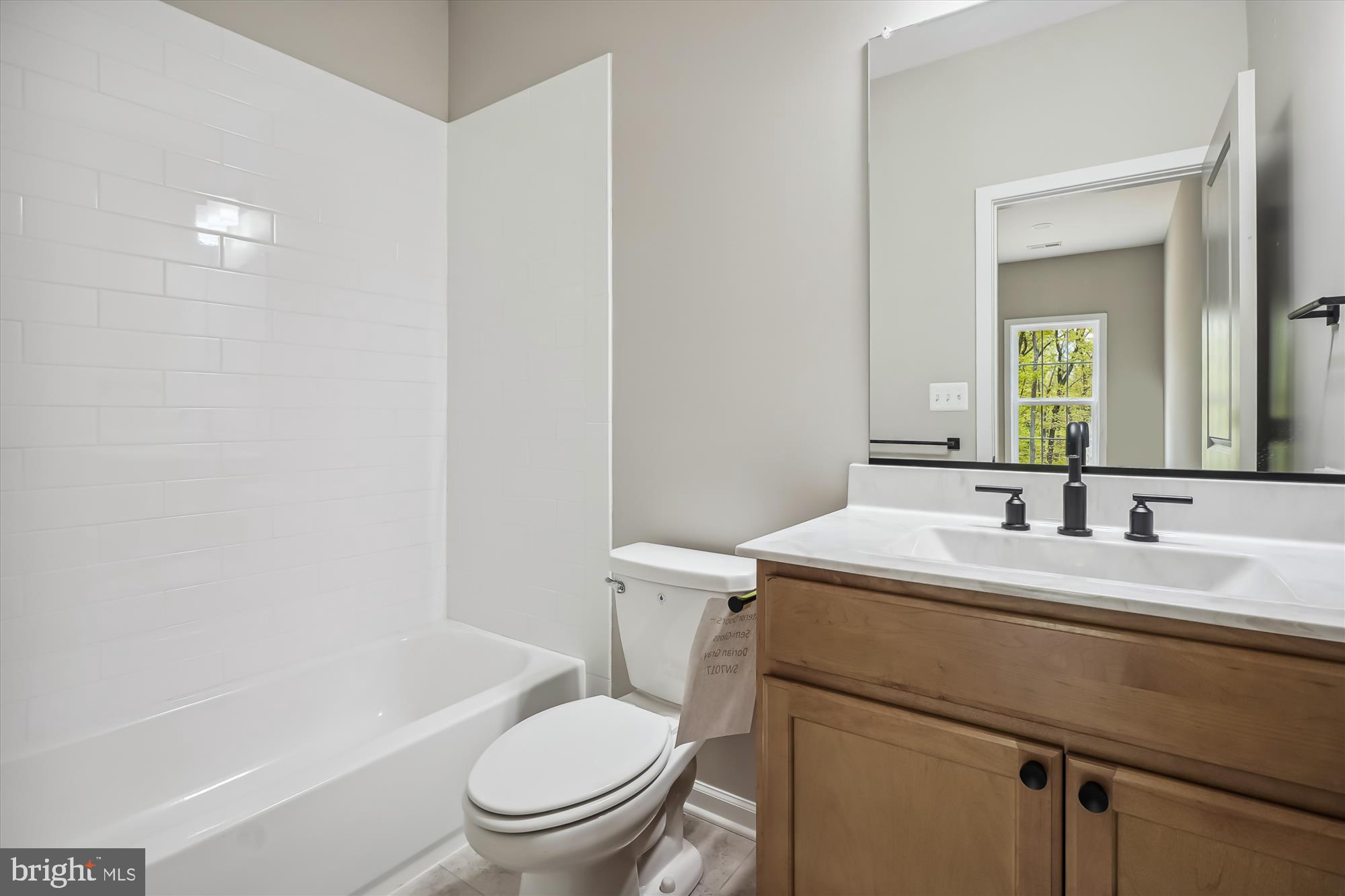 2 Eggbornsville Road Rixeyville, VA 22737 - Photo 49 of 63 a bathroom with a granite countertop toilet a sink and a mirror