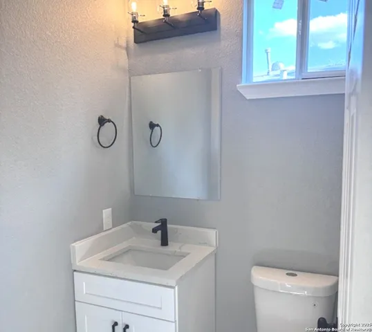 a bathroom with a sink and a toilet