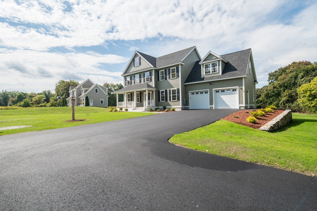37 Galloway Road Chelmsford, MA 01824 - Photo 1 of 30 a view of a white house with a big yard and potted plants