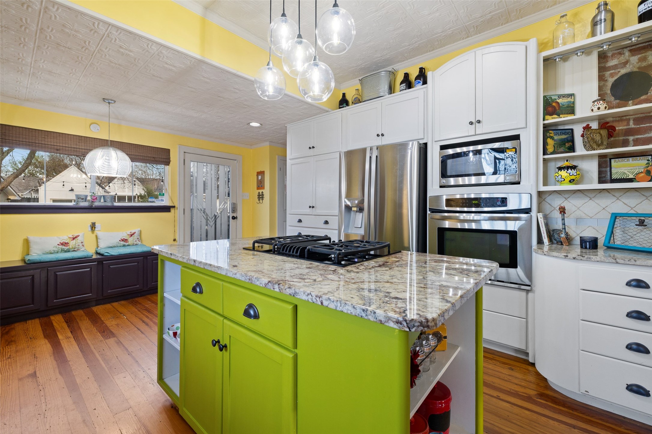 1507 South Church Street Georgetown, TX 78626 - Photo 19 of 40 a kitchen with stainless steel appliances granite countertop a stove and a refrigerator
