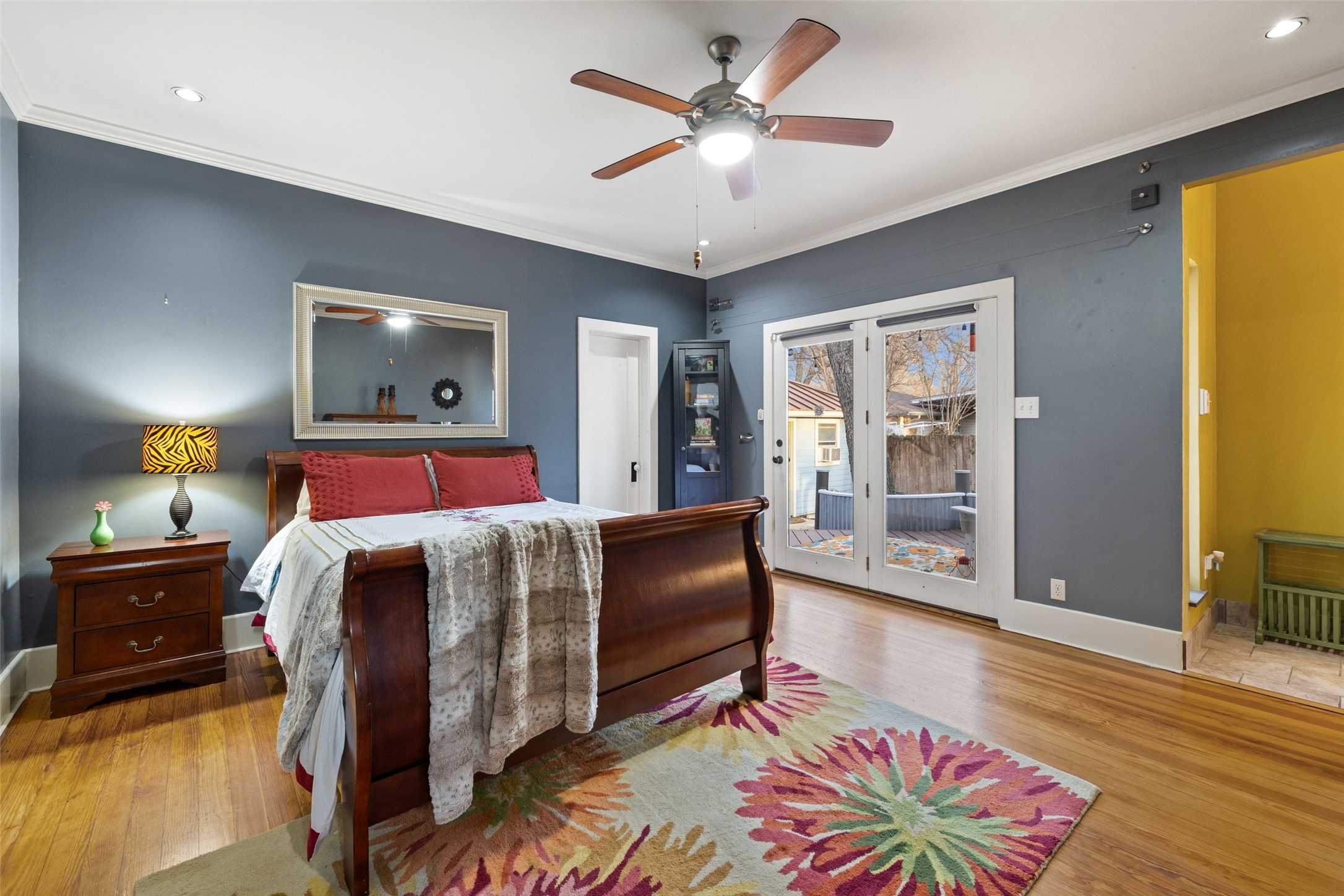 1507 South Church Street Georgetown, TX 78626 - Photo 20 of 40 a bedroom with a bed and a chandelier