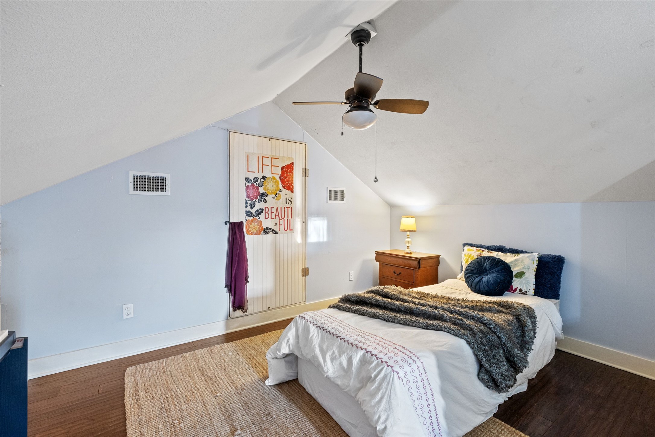 1507 South Church Street Georgetown, TX 78626 - Photo 29 of 40 a bedroom with a bed and wooden floor