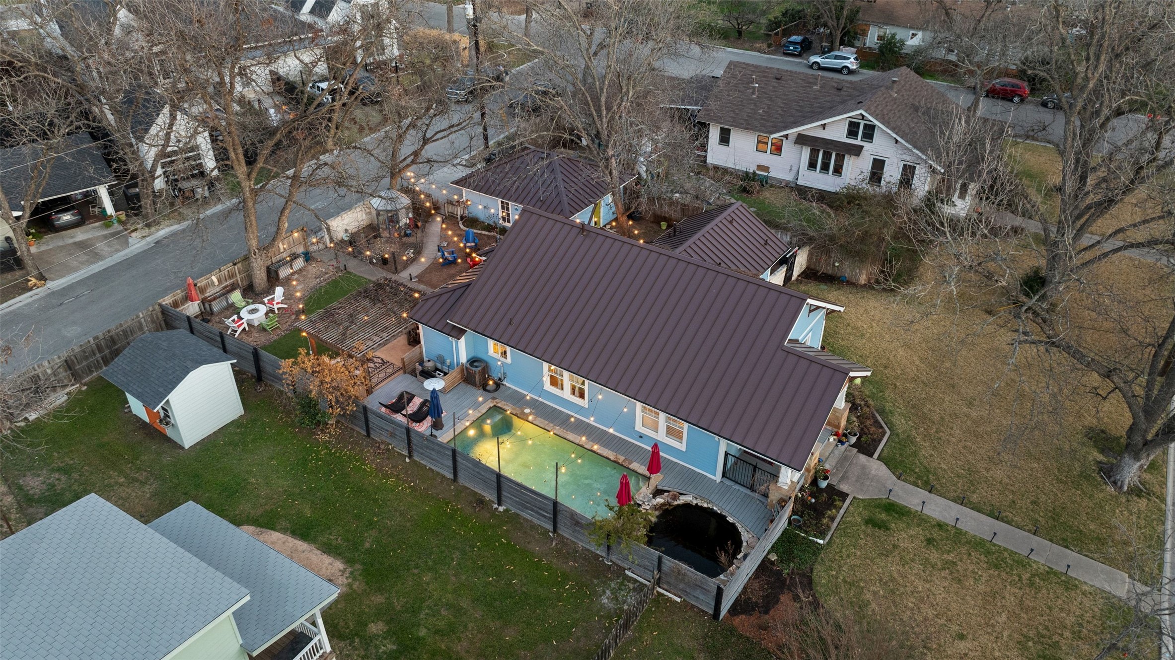 1507 South Church Street Georgetown, TX 78626 - Photo 3 of 40 an aerial view of a house with a garden and swimming pool