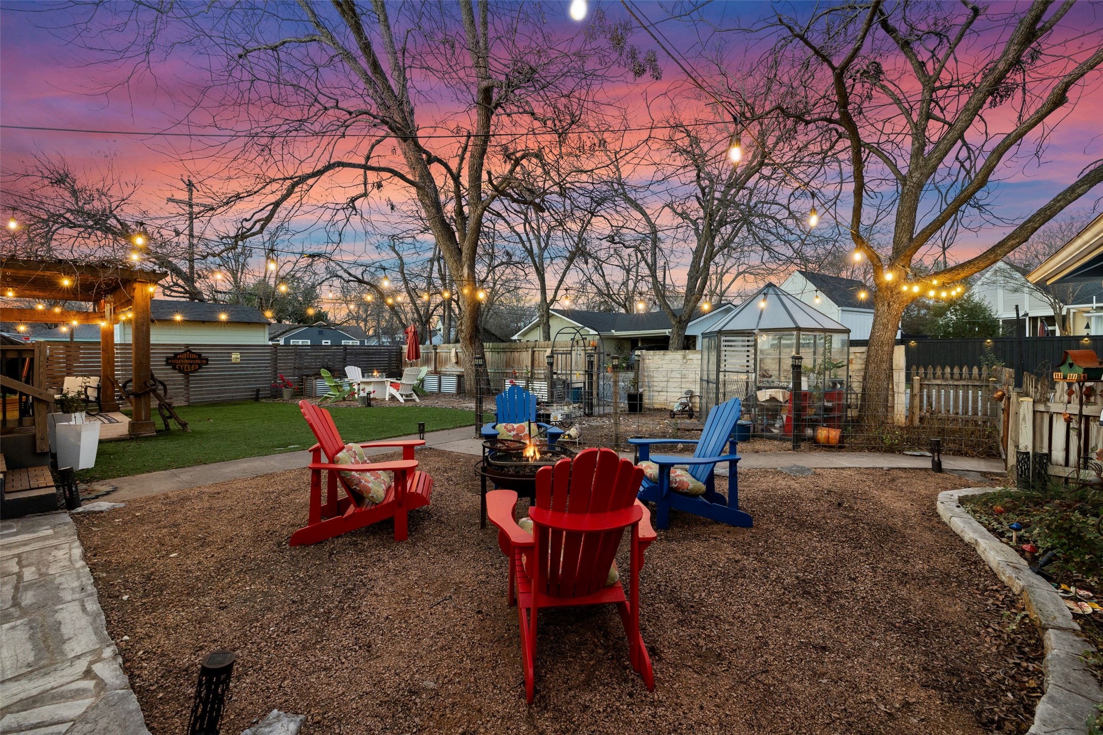 1507 South Church Street Georgetown, TX 78626 - Photo 32 of 40 a view of a backyard with table and chairs under an umbrella