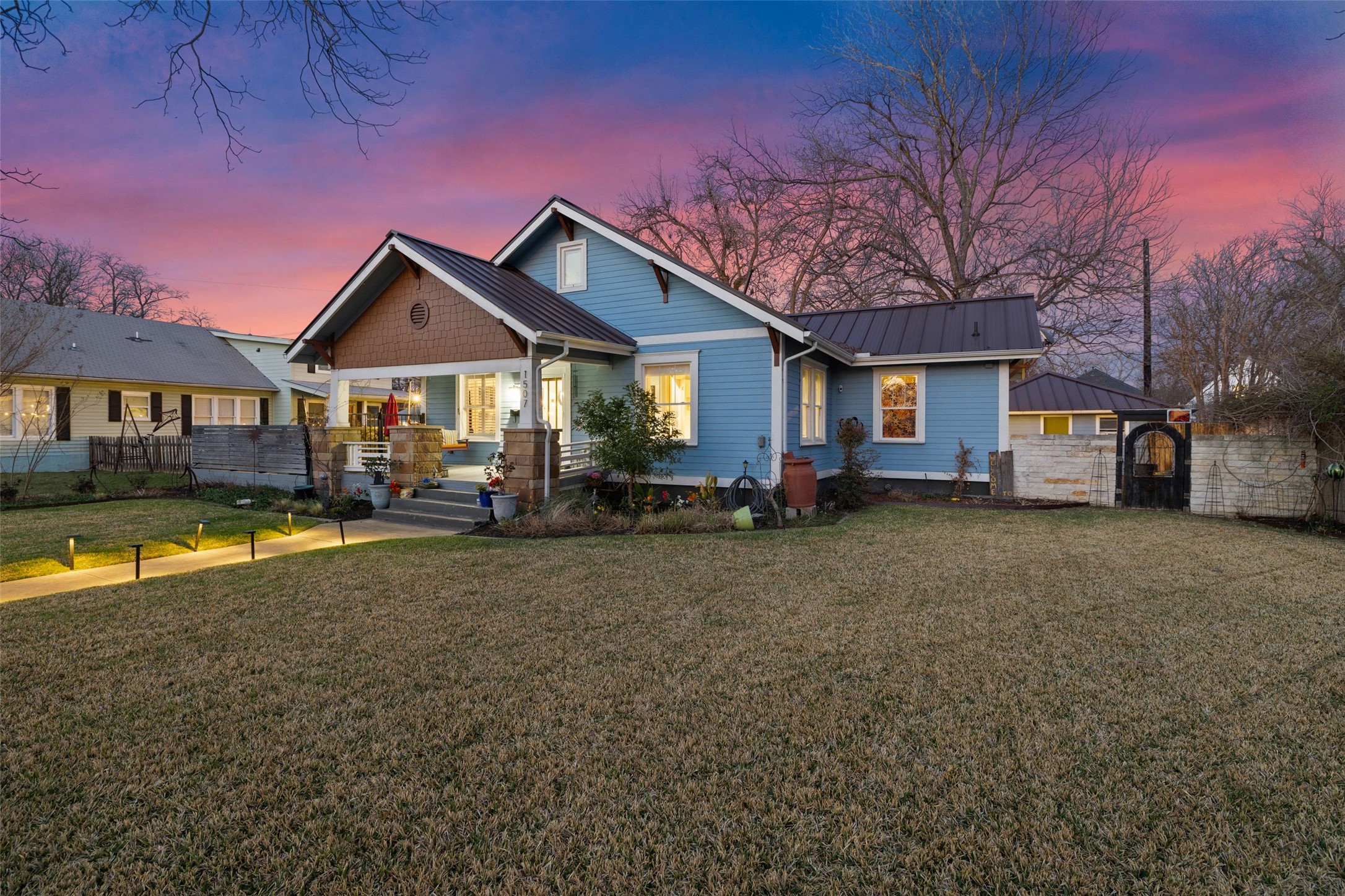 1507 South Church Street Georgetown, TX 78626 - Photo 8 of 40 a front view of a house with a yard outdoor seating and garage