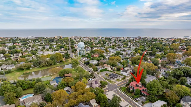 a backyard of a house with lots of green space and fountain