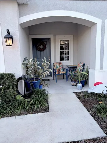 a front view of a house with outdoor seating