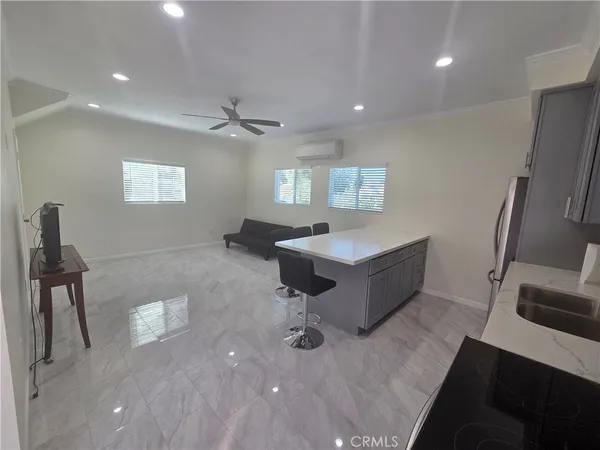 a kitchen with a sink stove and microwave
