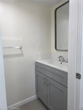 a white toilet sitting next to a shower
