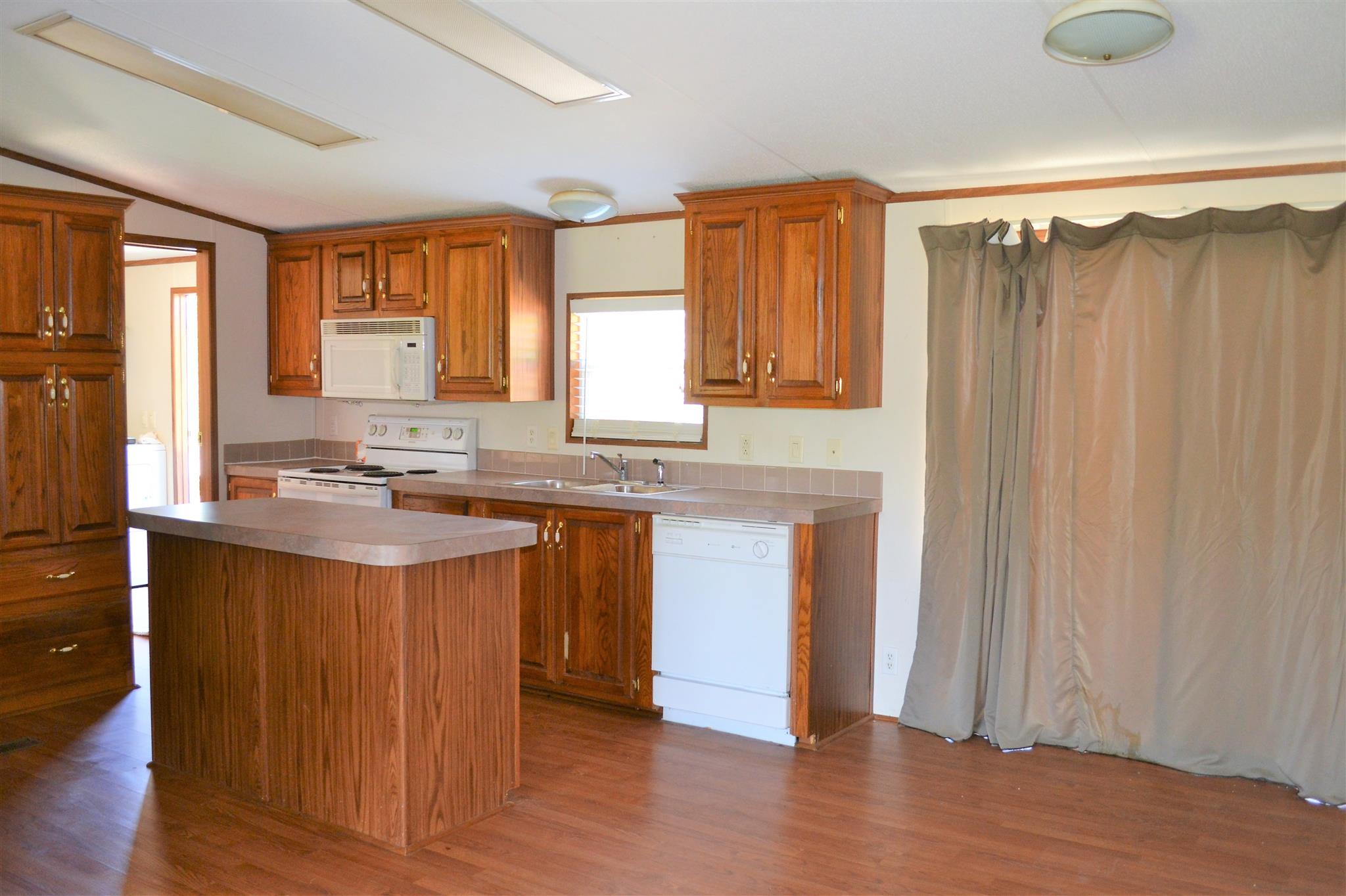 220 Knob Creek Road Lawrenceburg, TN 38464 - Photo 3 of 19 a view of kitchen with granite countertop window and wooden floor