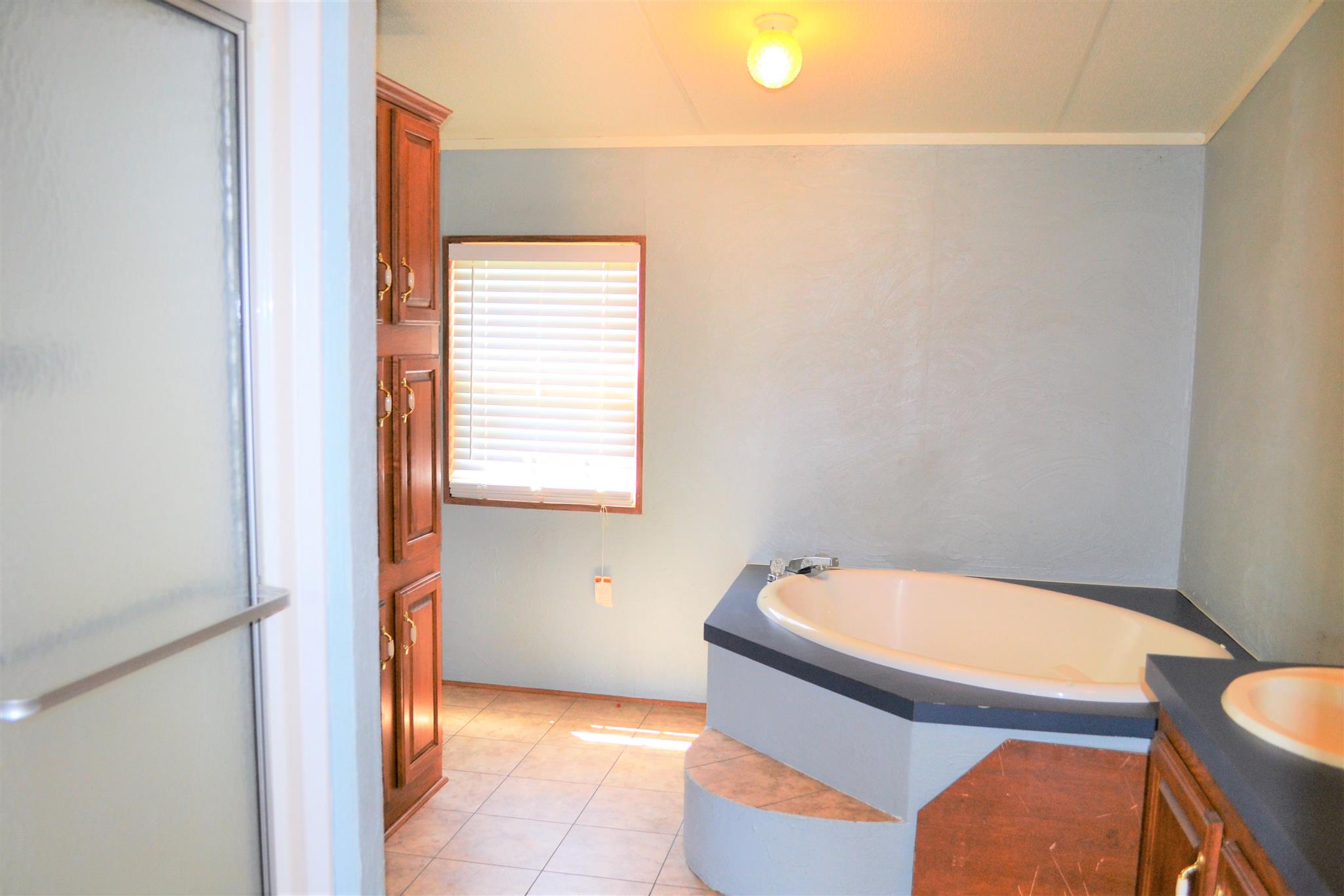 220 Knob Creek Road Lawrenceburg, TN 38464 - Photo 10 of 19 a bathroom with a sink and a mirror