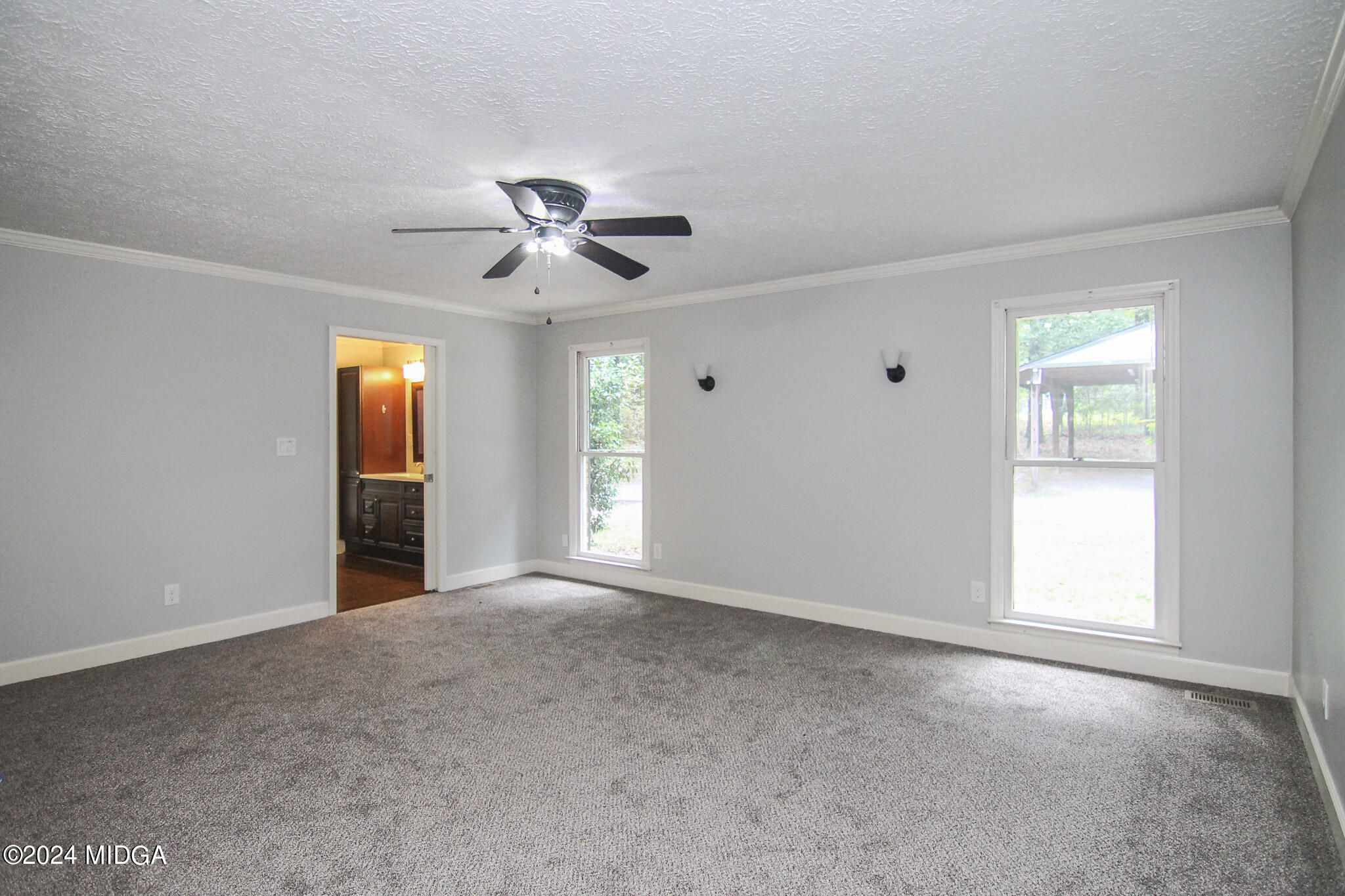 102 Nancy Place Bonaire, GA 31005 - Photo 16 of 48 a view of an empty room with a window