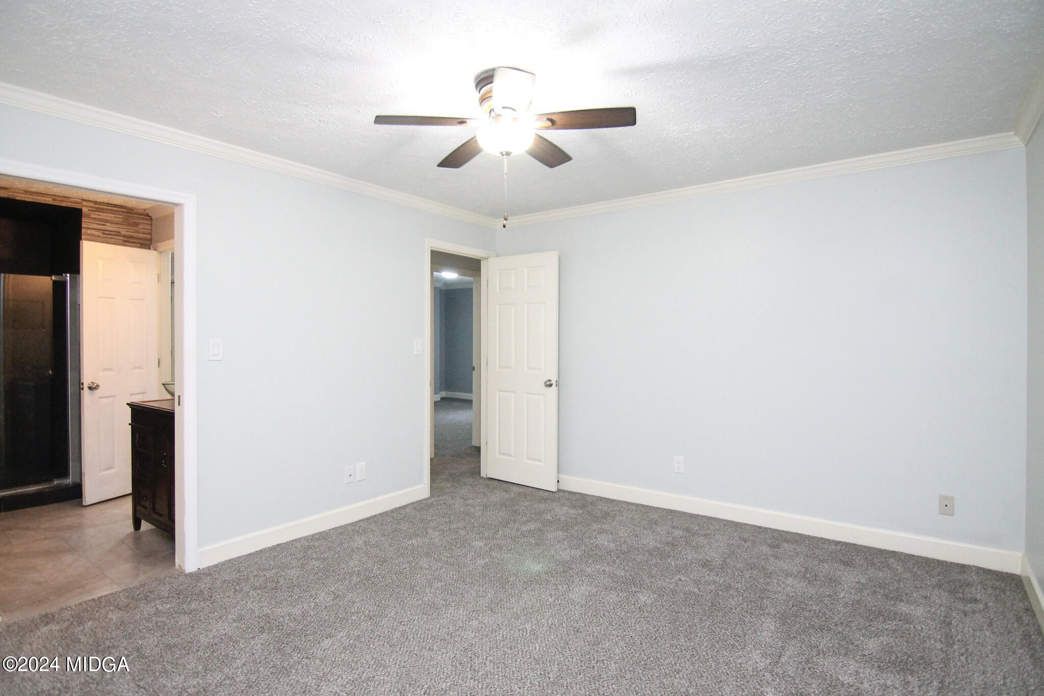 102 Nancy Place Bonaire, GA 31005 - Photo 22 of 48 an empty room with closet and a ceiling fan