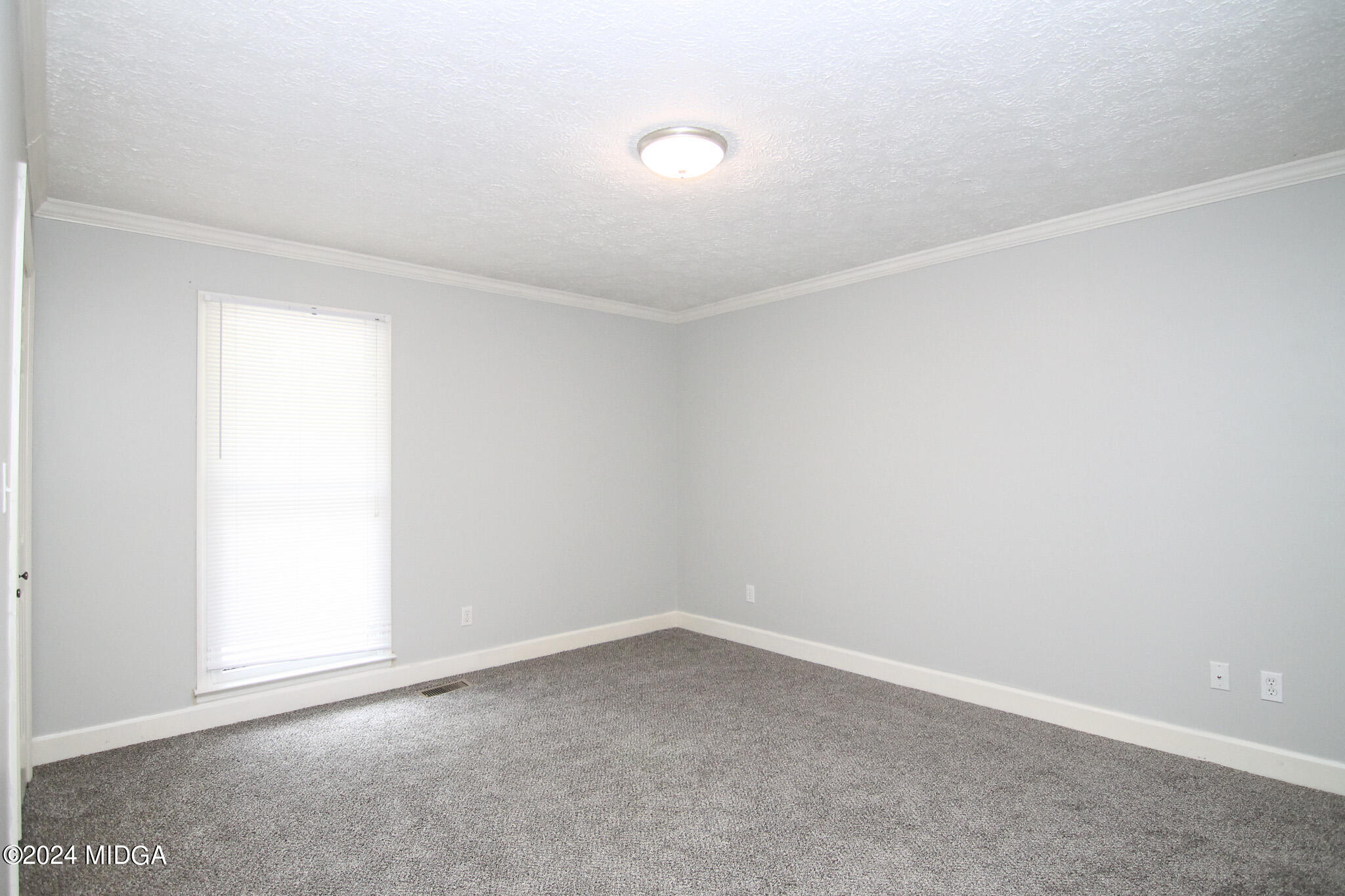 102 Nancy Place Bonaire, GA 31005 - Photo 24 of 48 an empty room with a empty space and a window