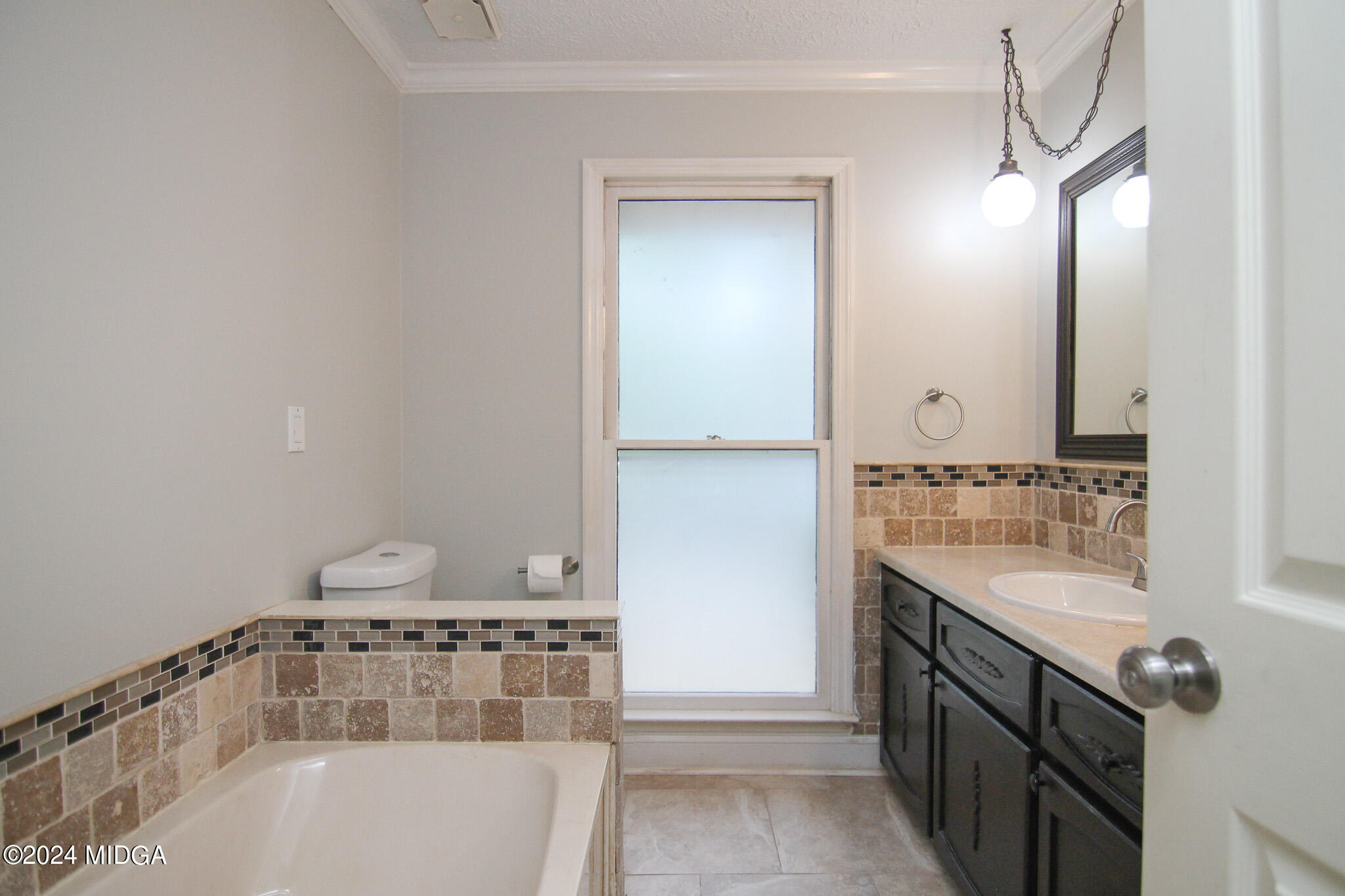 102 Nancy Place Bonaire, GA 31005 - Photo 27 of 48 a bathroom with a bathtub and a sink