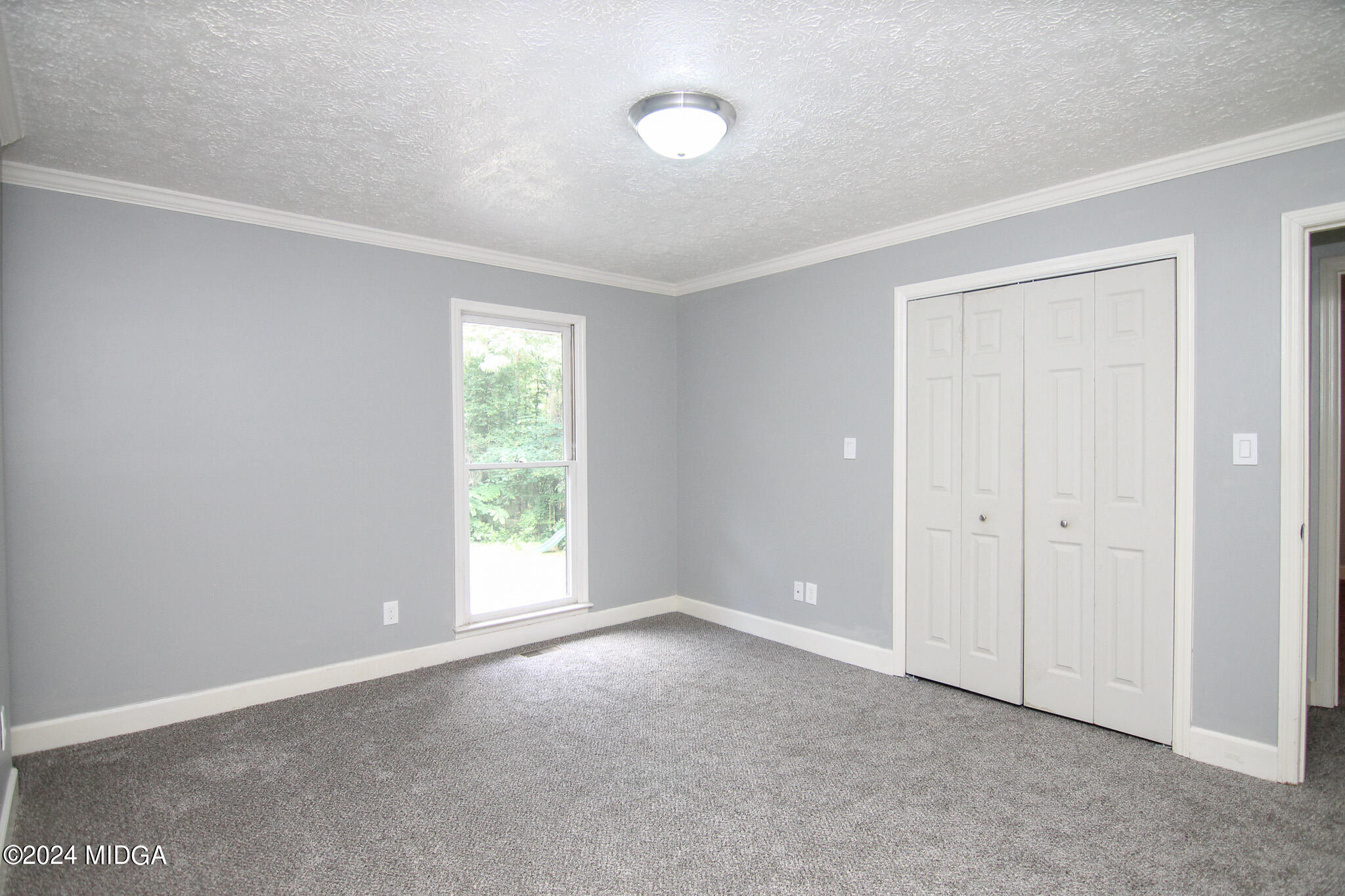 102 Nancy Place Bonaire, GA 31005 - Photo 29 of 48 a view of an empty room with a window
