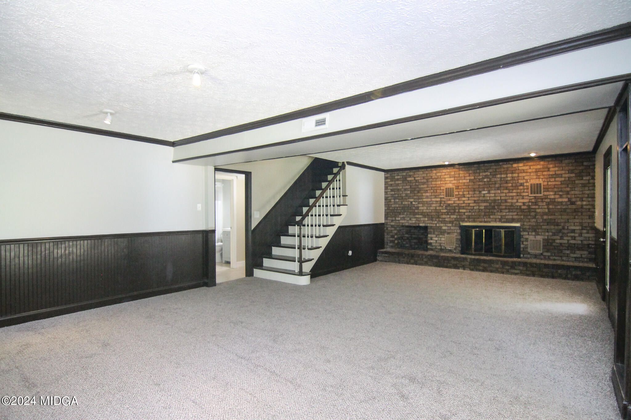 102 Nancy Place Bonaire, GA 31005 - Photo 32 of 48 a view of an empty room with stairs