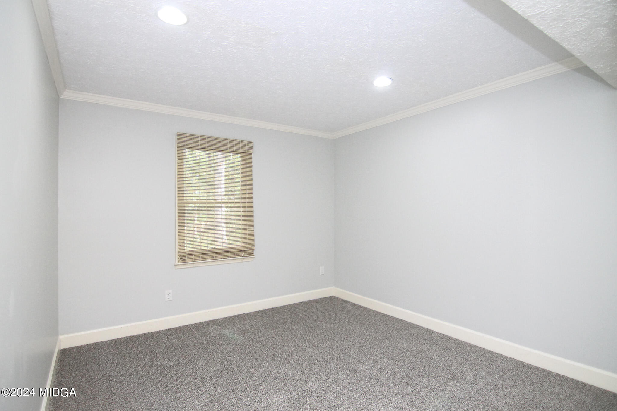102 Nancy Place Bonaire, GA 31005 - Photo 34 of 48 an empty room with a window