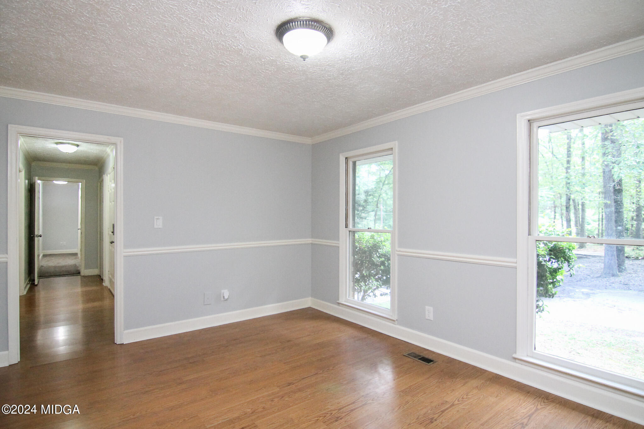 102 Nancy Place Bonaire, GA 31005 - Photo 10 of 48 wooden floor in an empty room with a window