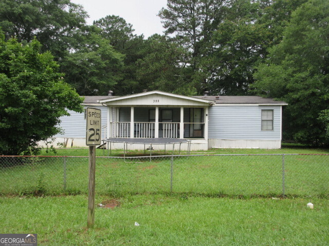 a house view with a garden space