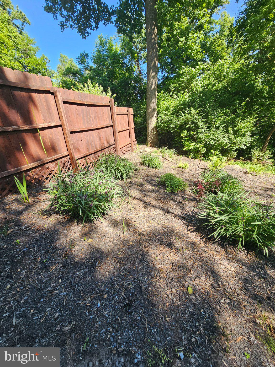 32 Parnassus Road Linden, VA 22642 - Photo 38 of 50 Lush garden retreat behind wooden fence.