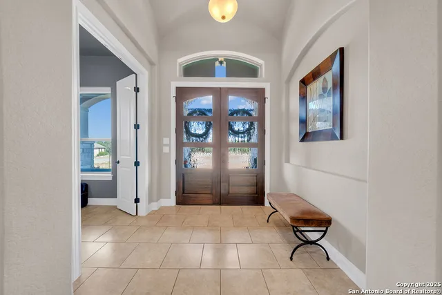 a view of an entryway with wooden floor
