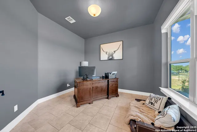 a workspace with furniture and window