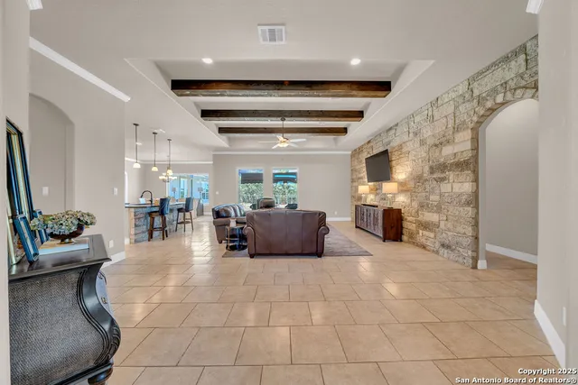 a lobby with furniture and a fireplace