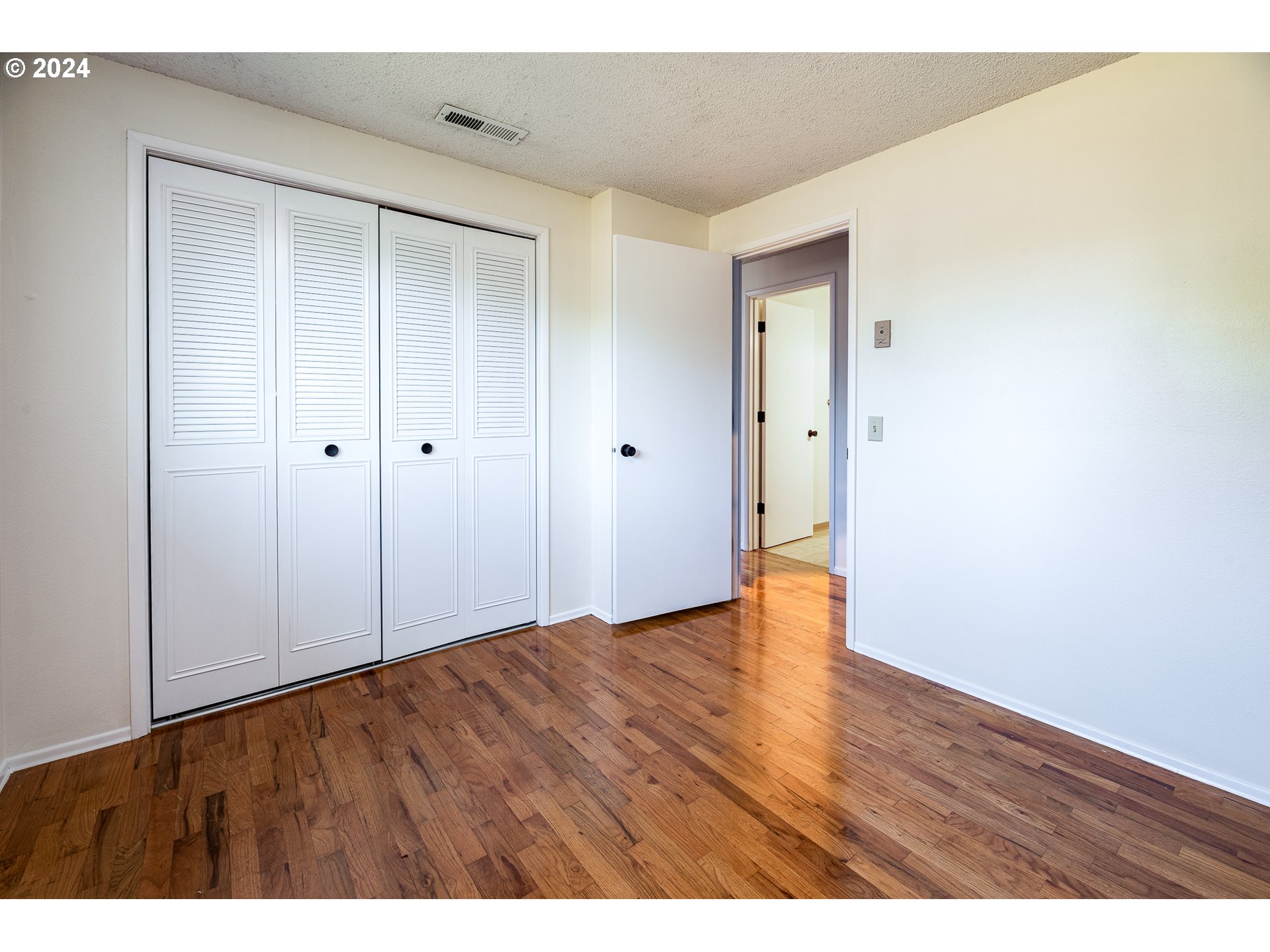 3726 Jasper Road Springfield, OR 97478 - Photo 23 of 45 a view of an empty room with wooden floor