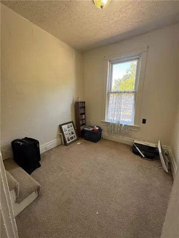 a room with a window and gym equipment