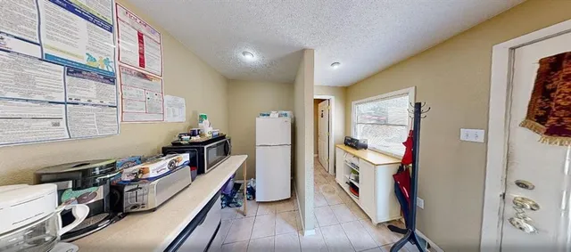 a view of a hallway with workspace