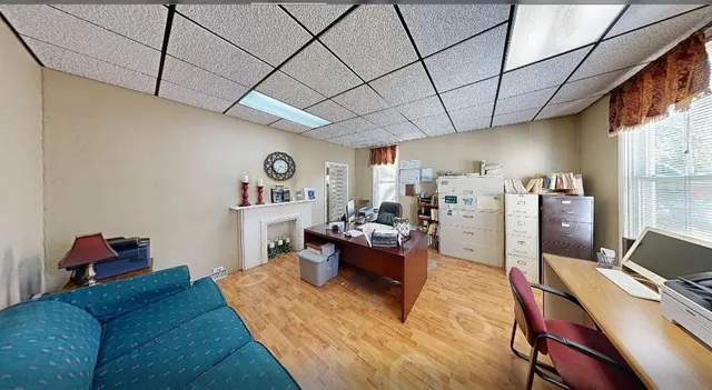 a living room with furniture and a window