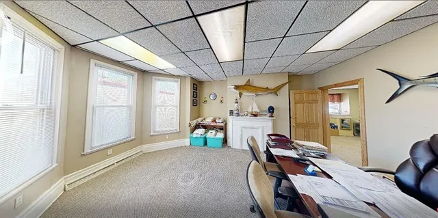 a view of a livingroom with furniture and a window