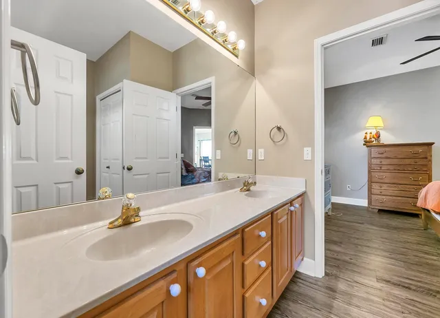 a bathroom with a sink double vanity and a mirror