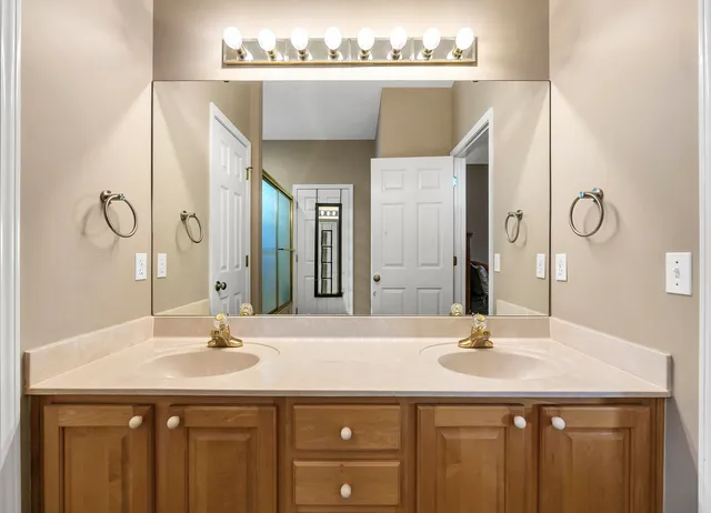 a bathroom with a sink and a mirror