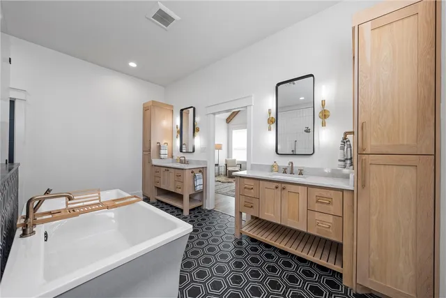 a kitchen with stainless steel appliances granite countertop a refrigerator and a stove