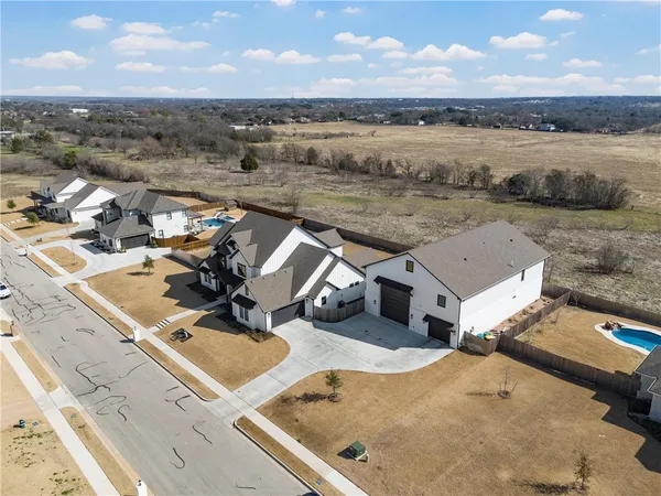 an aerial view of a house with a ocean view