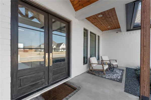 a view of kitchen island with furniture and wooden floor