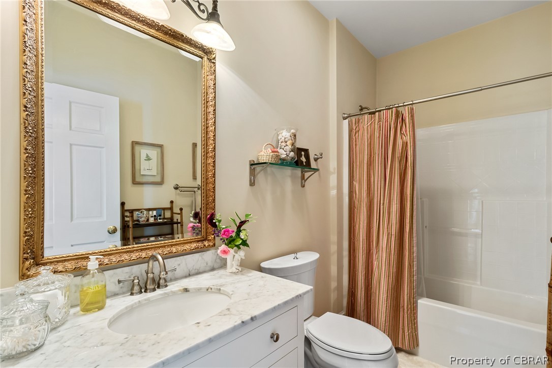 3215 Weems Road Weems, VA 22576 - Photo 46 of 50 a bathroom with a granite countertop sink toilet and shower