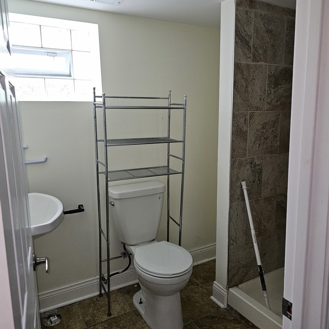 1750 183rd Street Homewood, IL 60430 - Photo 12 of 14 a bathroom with a toilet and a shower