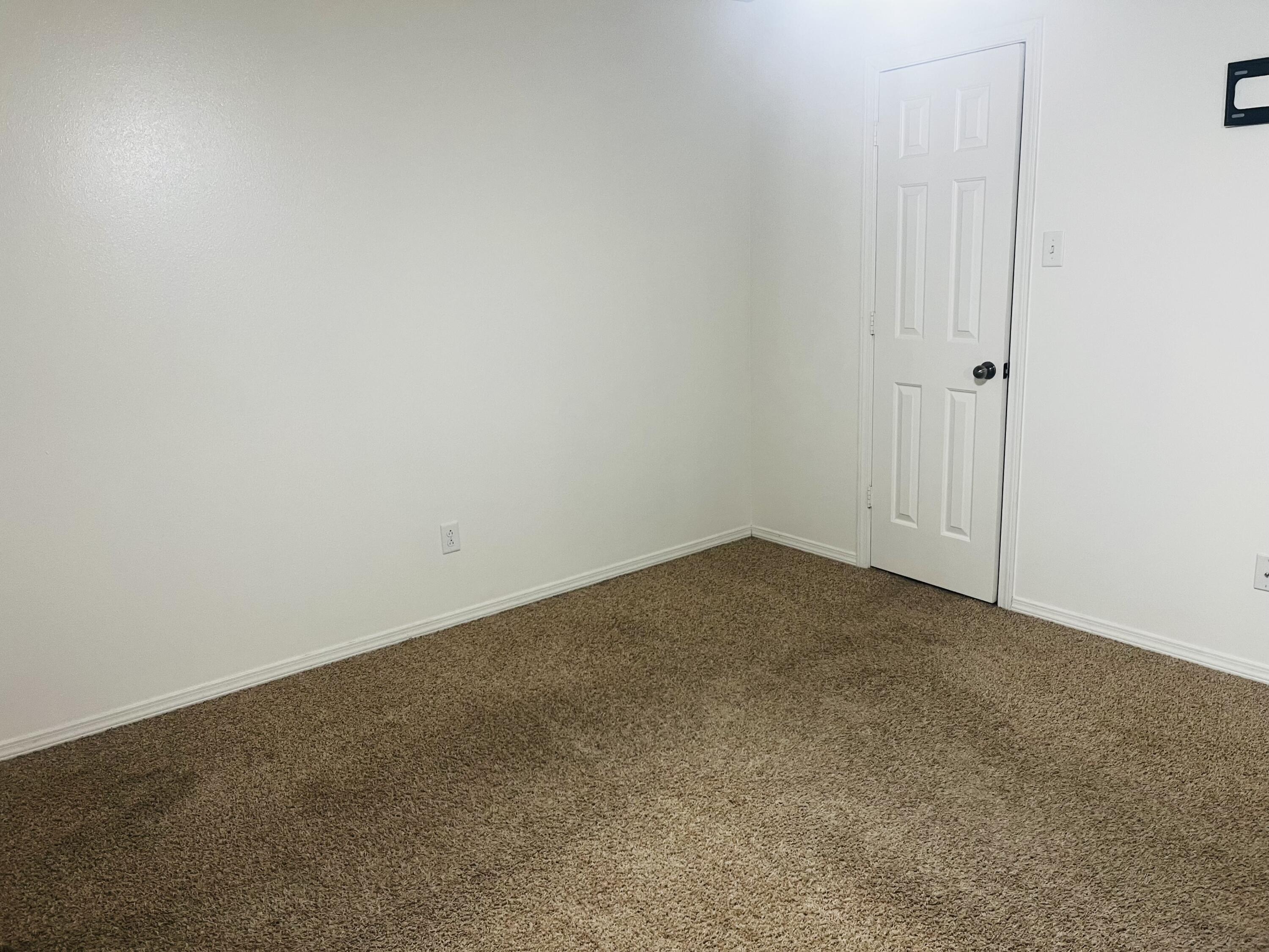 10016 Weatherford Avenue Lubbock, TX 79423 - Photo 14 of 29 an empty room with an entryway