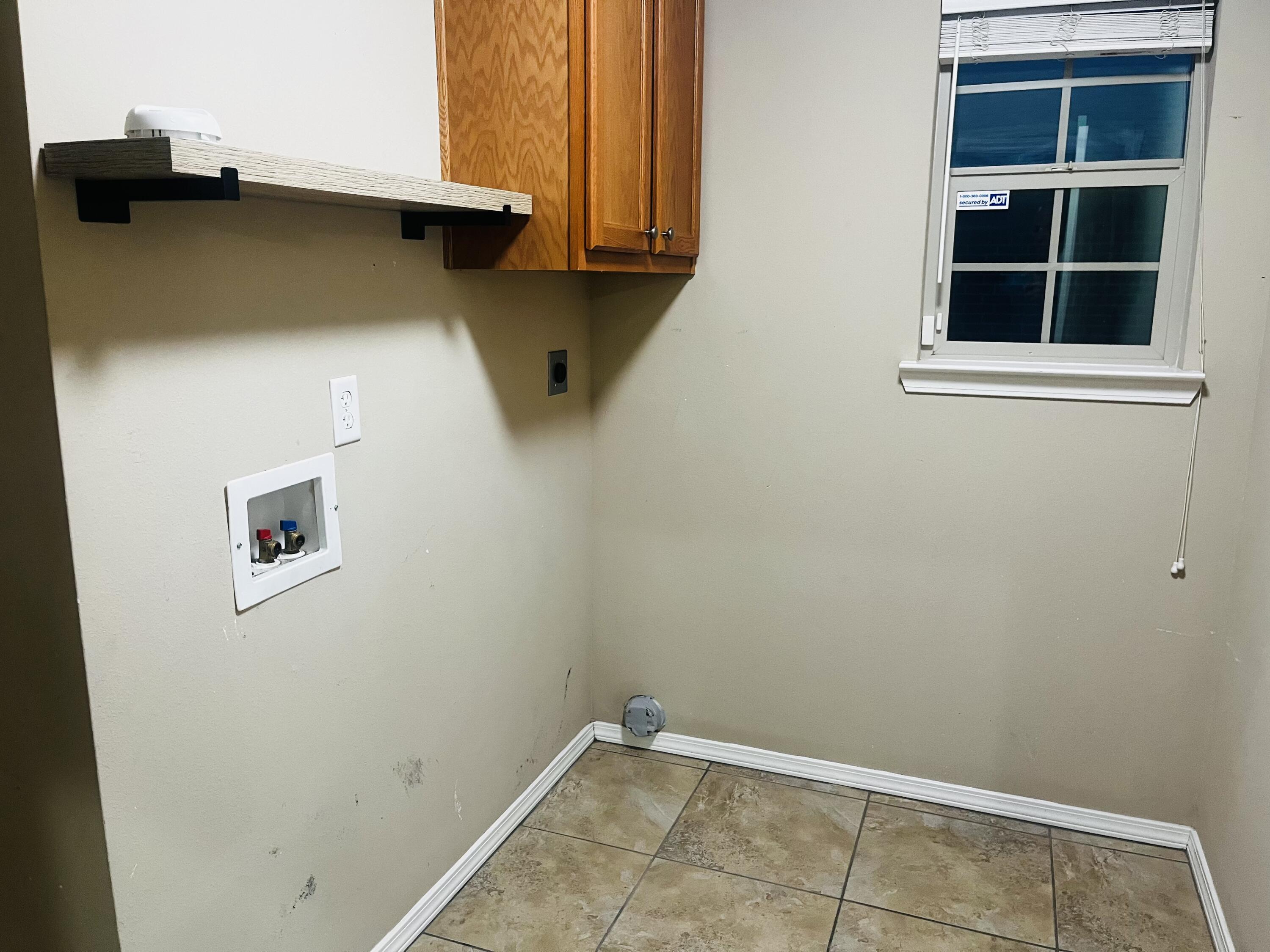 10016 Weatherford Avenue Lubbock, TX 79423 - Photo 25 of 29 a view of walk in closet with empty racks