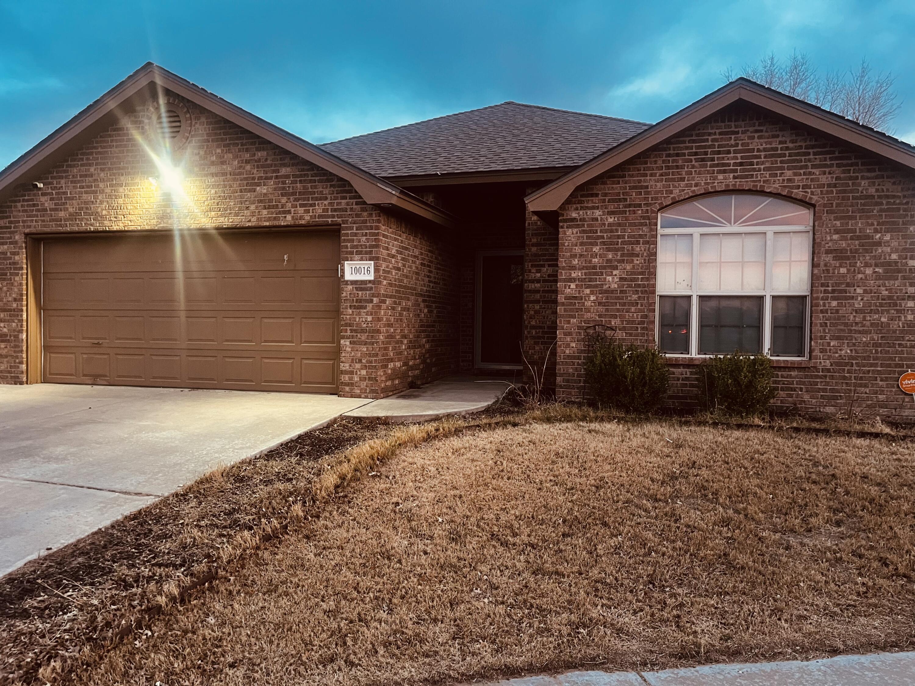 10016 Weatherford Avenue Lubbock, TX 79423 - Photo 27 of 29 a front view of a house with a yard
